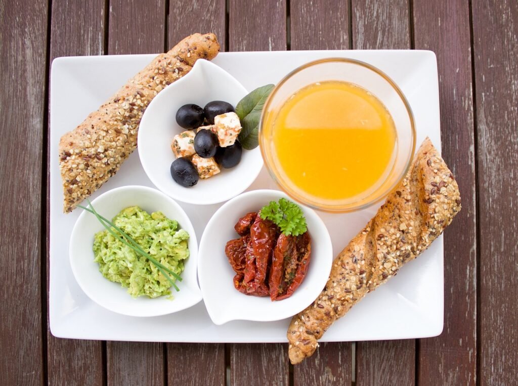 breakfast, orange juice, loaf, whole wheat, whole grain bread, guacamole, nourishment, yummy, meal, breakfast table, have breakfast, plate, healthy, tasty, food, vitamins, in the morning, breakfast, breakfast, breakfast, breakfast, breakfast, food